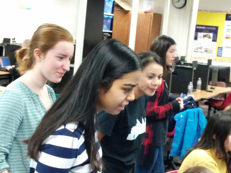 Abby, Abigail, Heylin, and Lena teaching middle school girls CS